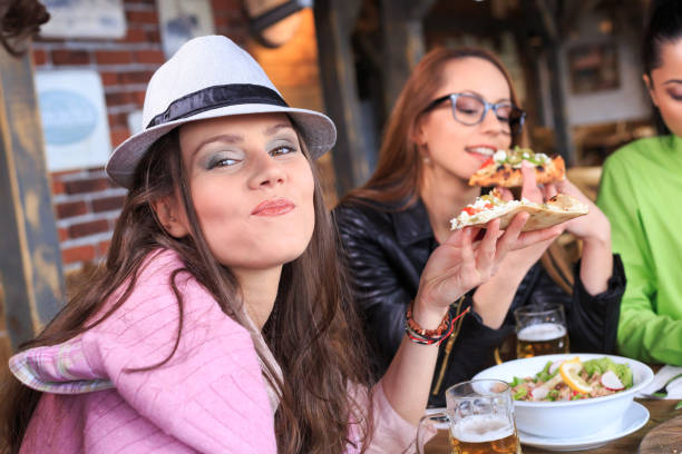istock Young people eating pizza in restaurant 925681214