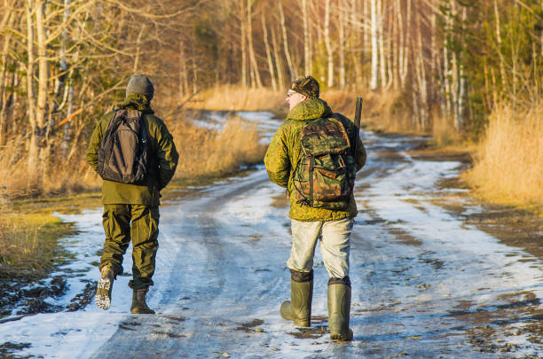 istock Two hunters in the forest in late autumn 925684600