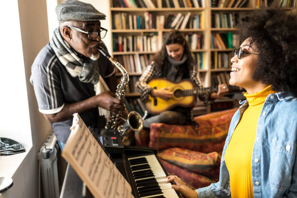 istock African woman playing the piano and singing 925685314