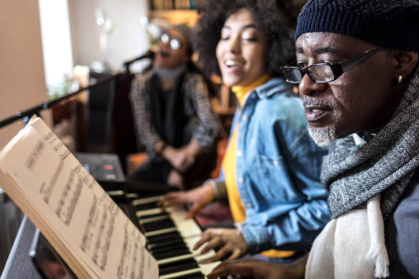 istock African ethnicity duo playing the piano at home 925685318