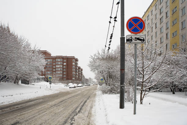 istock The city road is covered with snow. 925685416