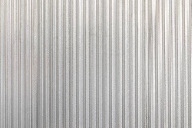 istock The corrugated grey metal wall background. Rusty zinc grunge texture and background. 925688678