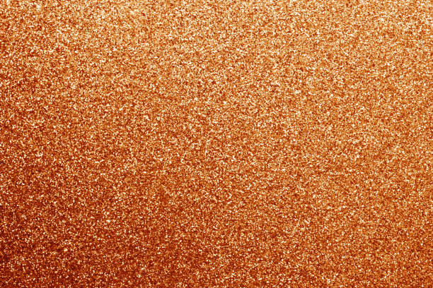 istock Glittering background in orange color. 925693240