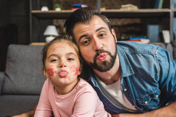 istock father and daughter with painted faces 925697324