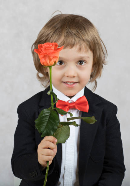 istock Small boy of four years with a rose. 925709514