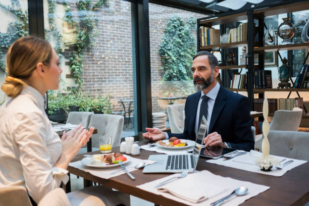 istock Business people have a meal in hotel restaurant 925712426