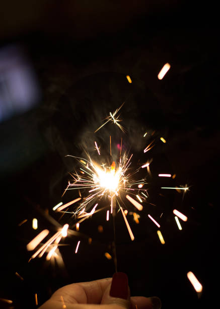 istock Burning party sparkler on black background 925713724