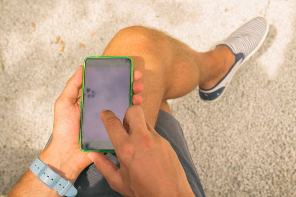 istock Man texting on smart phone outdoors. 925713742