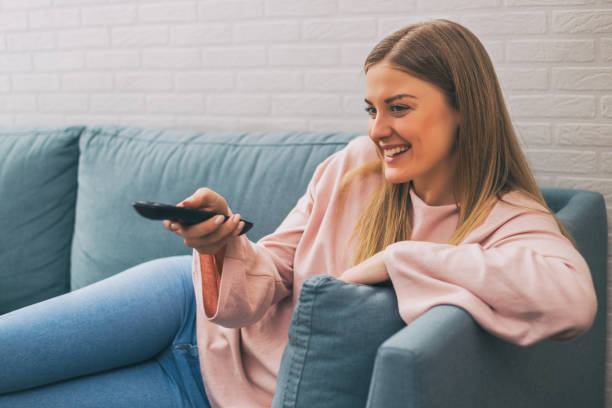 istock Woman watching tv 925714068
