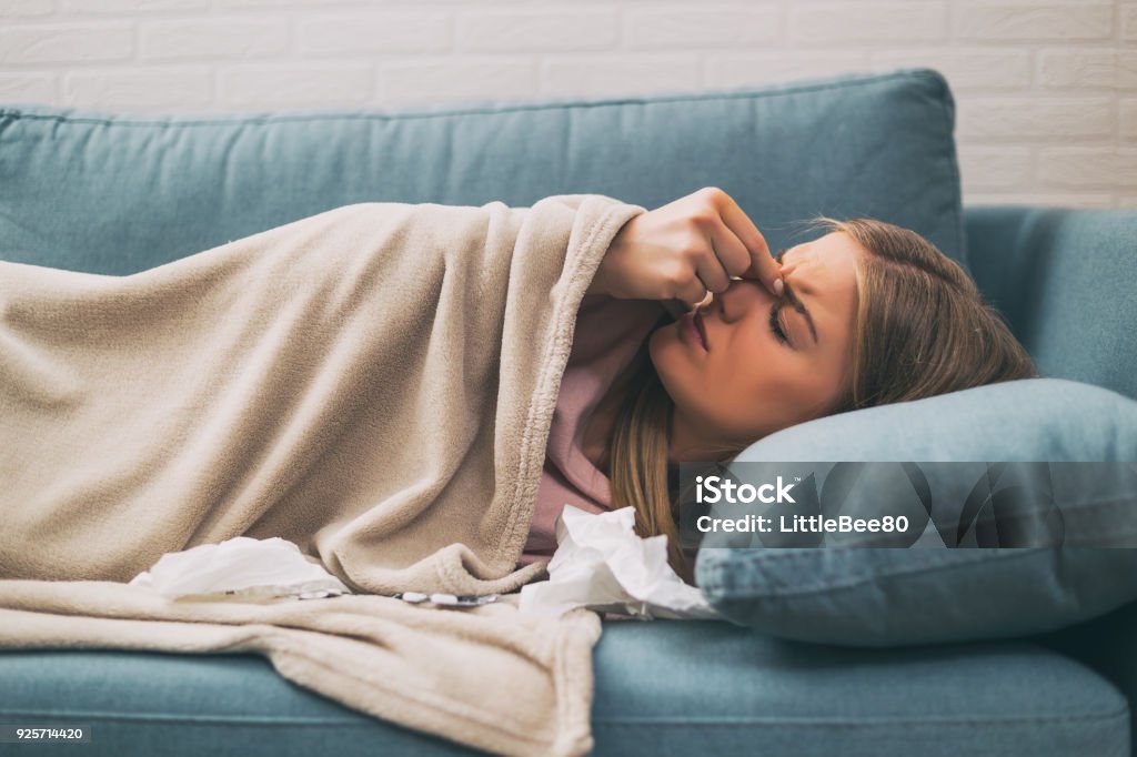 Woman having fever Woman having pain in sinus and fever.Image is intentionally toned. Paranasal Sinus Stock Photo