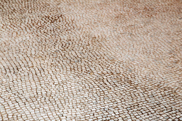istock Stone pavement texture, abstract background of old cobblestone pavement close-up. 925714798