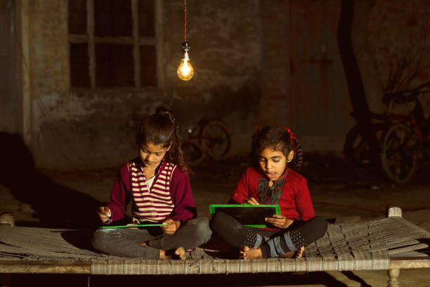 Rural girls studying in light bulb