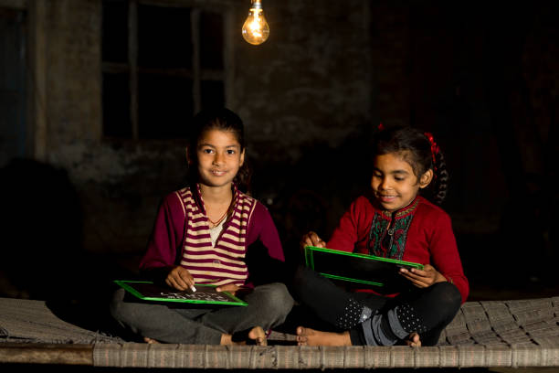 istock Rural girls studying in light bulb 925720286