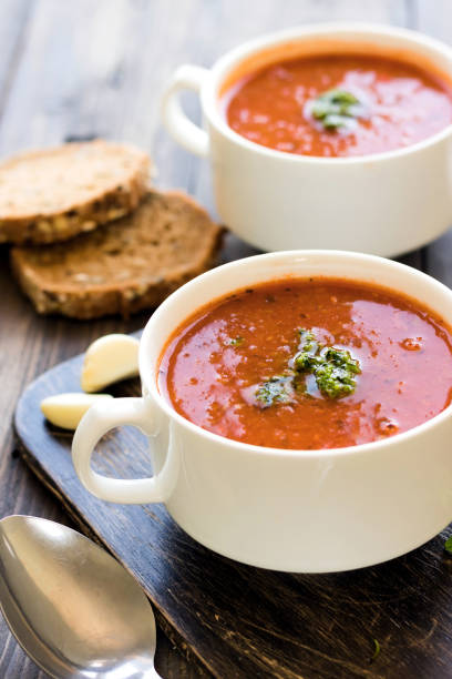 istock Thick Italian soup minestrone on a wooden table 925720374