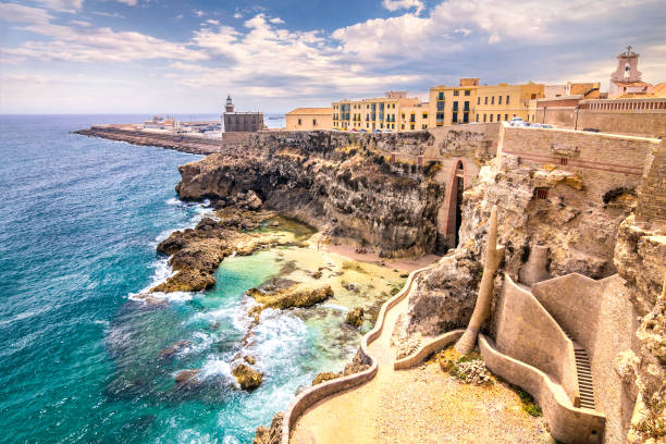 City walls, lighthouse and harbor in Melilla. City walls, lighthouse and harbor in Melilla, Spanish province in Morocco. The rocky coast of the Mediterranean Sea. morocco landscape stock pictures, royalty-free photos & images