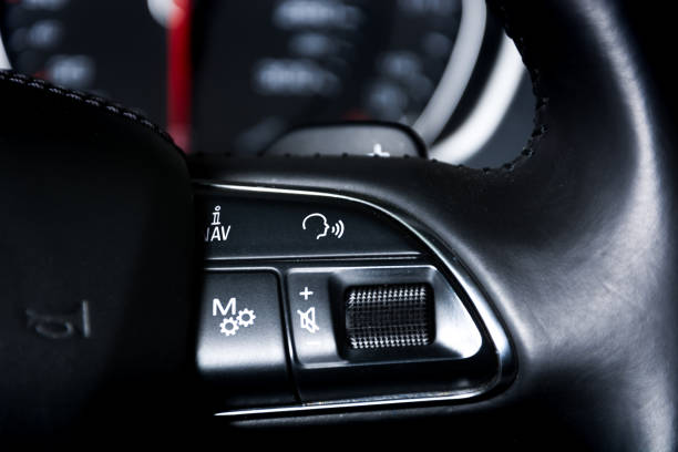 istock Cruise control and speed limiter buttons on the car steering wheel 925722786