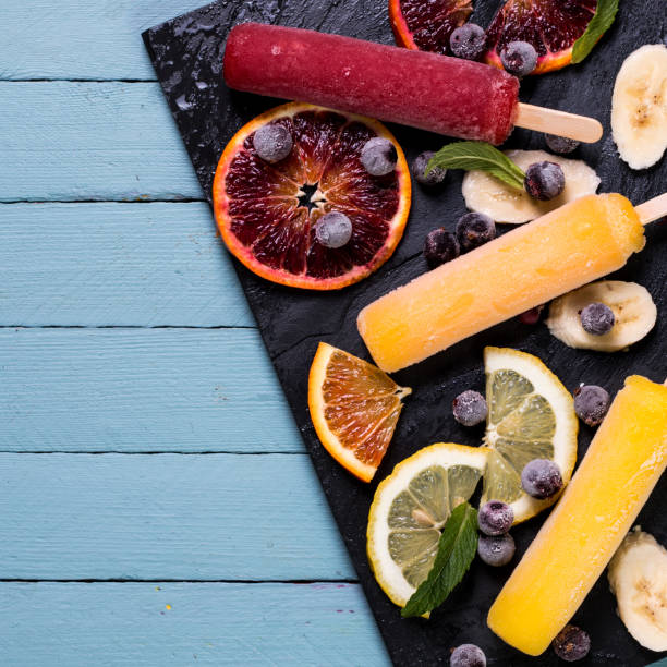 istock Colorful popsicles with fresh fruits. Summer refreshing icecream 925723418