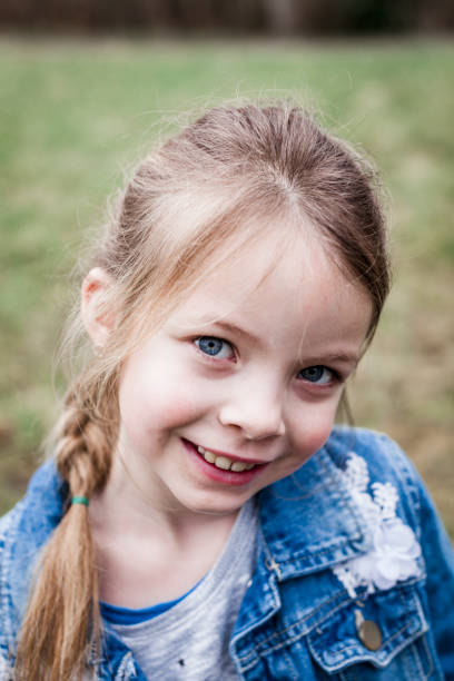 istock beautiful blond girl posing outdoor 925724610
