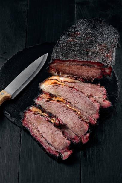 istock Fresh Brisket BBQ beef sliced for serving against a dark background 925725724