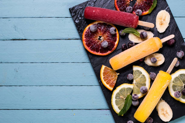 istock Colorful popsicles with fresh fruits. Summer refreshing icecream 925725958