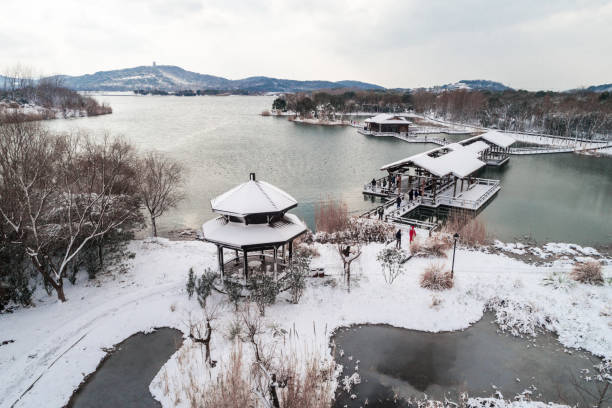 istock Winter snow scene in jiangnan park, China. 925726556
