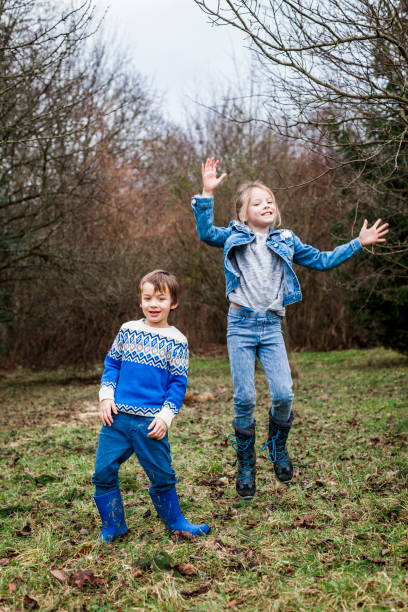 istock brother and sister playing outdoor 925726834