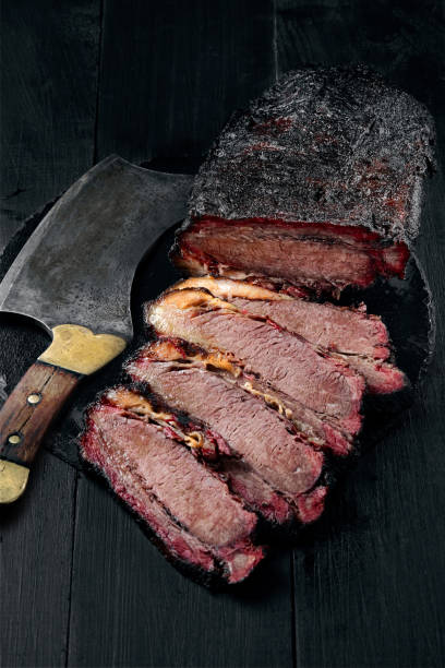 istock Fresh Brisket BBQ beef sliced for serving against a dark background 925726974