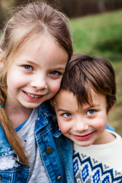 istock brother and sister playing outdoor 925727014
