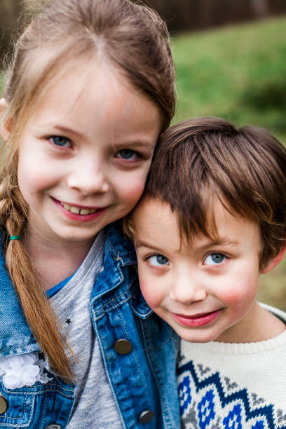 istock brother and sister playing outdoor 925727032