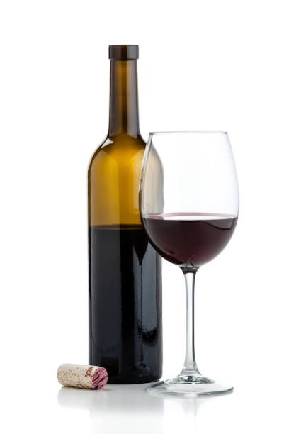 istock Wineglass and open half full wine bottle 925732070