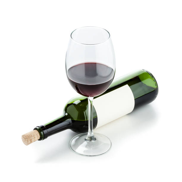 istock Wineglass and half full wine bottle 925732080