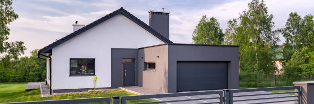 istock Villa with fence and garage 925732548