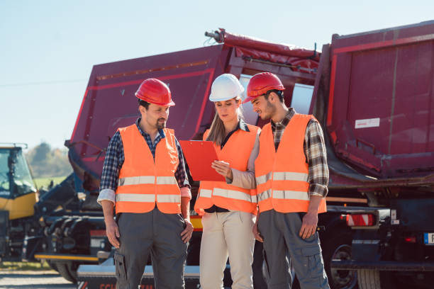 istock Workers in a heavy transport freight forwarding company 925733564