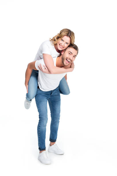 istock excited man piggybacking his girlfriend, isolated on white 925733934