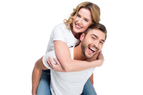 istock excited man piggybacking his smiling girlfriend, isolated on white 925734276