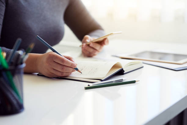 istock Woman sketching graphic design in his diary 925738120