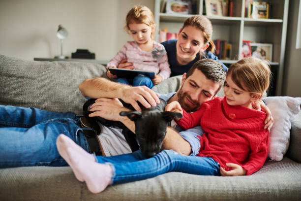 istock Family with children and a dog 925738482