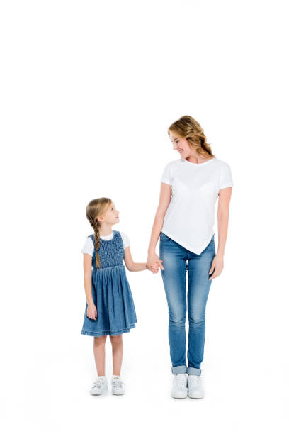 istock happy mother and daughter holding hands, isolated on white 925738578