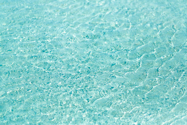 Rippled shallow sea water surface background from directly above