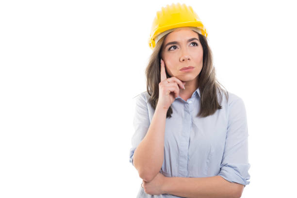 istock Portrait of female constructor making thinking gesture 925746632