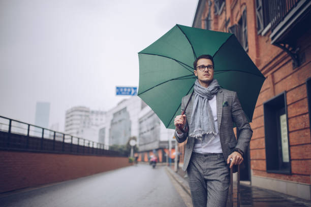 istock Man with suitcase on the street 925746970