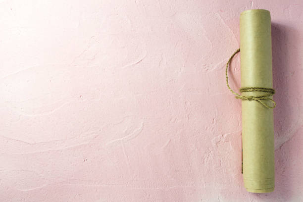 A roll of paper tied with a rope. Free space for text .