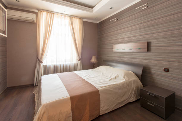 istock cozy bedroom in brown tones and window 925754312