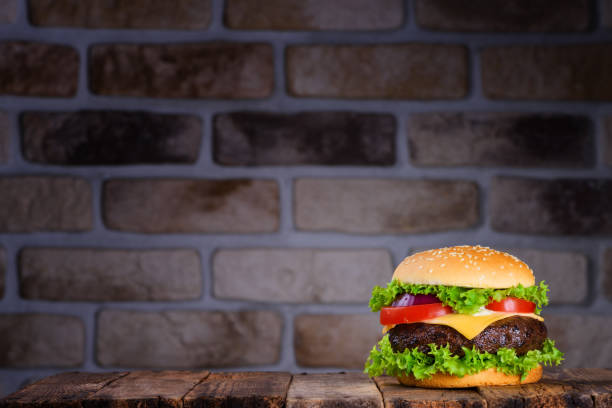 istock Big classic hamburger on wooden table 925758180