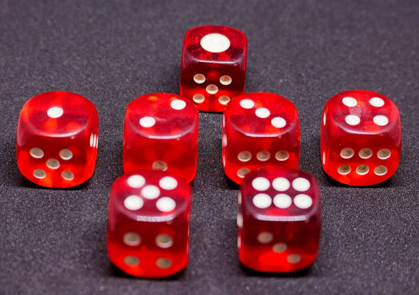 istock Bones for playing poker in red on a dark background.  One to six. 925766110