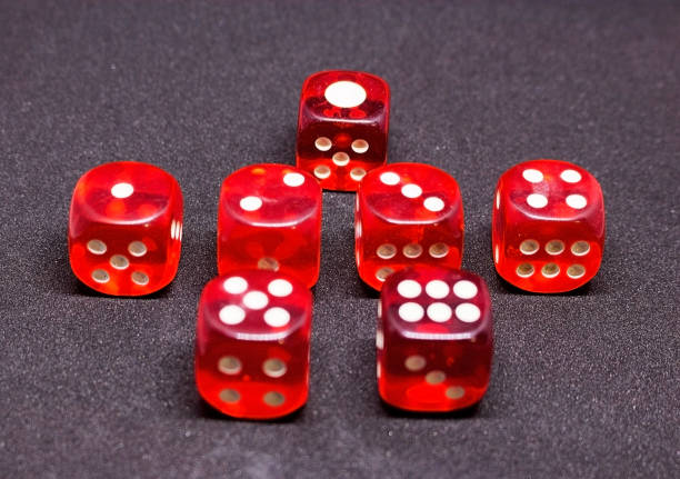 istock Bones for playing poker in red on a dark background.  One to six. 925766208