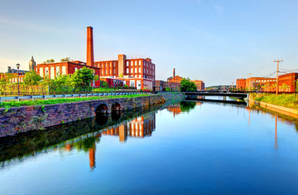 istock Mills reflecting on a canal in Holyoke Massachusetts 925767020
