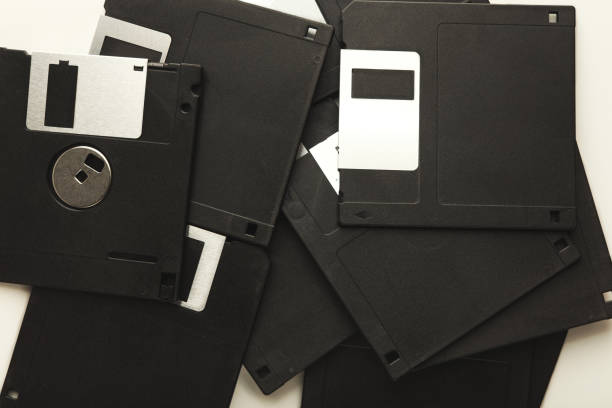 istock Heap of retro floppy disks isolated on white background 925767318
