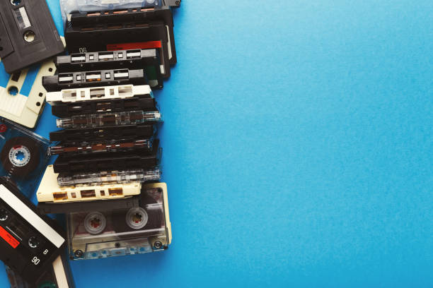 istock Vintage audio cassettes border on blue background 925769006