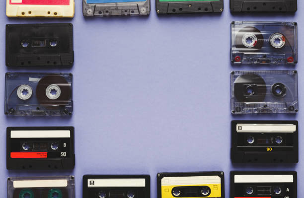 istock Vintage audio cassettes frame on violet background 925769866